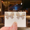Wholesale Women's S925 Silver Needle Bow Stud Earrings With Micro Inlaid Pearl And Electroplated Alloy Material
