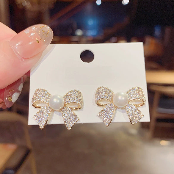 Wholesale Women's S925 Silver Needle Bow Stud Earrings With Micro Inlaid Pearl And Electroplated Alloy Material