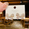Wholesale Women's S925 Silver Needle Bow Stud Earrings With Micro Inlaid Pearl And Electroplated Alloy Material
