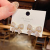 Wholesale Women's S925 Silver Needle Bow Stud Earrings With Micro Inlaid Pearl And Electroplated Alloy Material
