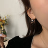 Wholesale Women's S925 Sterling Silver And Copper Irregular Earrings With Leaf Pattern And Simple Metal Design Ear Buckle