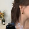 Wholesale Women's S925 Sterling Silver And Copper Irregular Earrings With Leaf Pattern And Simple Metal Design Ear Buckle