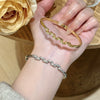 Wholesale Women's Semicircular Cross Design Goldplated Brass Bracelet With Microinlaid Diamonds Light Luxury Style