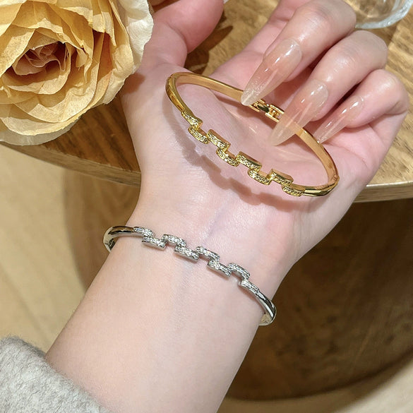 Wholesale Women's Semicircular Cross Design Goldplated Brass Bracelet With Microinlaid Diamonds Light Luxury Style