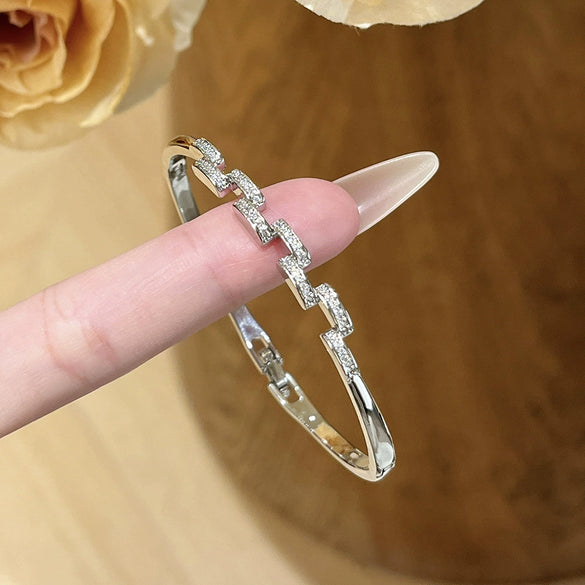 Wholesale Women's Semicircular Cross Design Goldplated Brass Bracelet With Microinlaid Diamonds Light Luxury Style