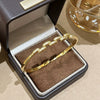 Wholesale Women's Semicircular Cross Design Goldplated Brass Bracelet With Microinlaid Diamonds Light Luxury Style