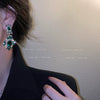 Wholesale Women's Silver Needle Earrings With Diamond And Emerald Inlay Geometric Design Alloy Material Exaggerated Elegant Light Luxury Style
