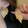 Wholesale Women's Silver Needle Hollow Flower Tassel Earrings With Real Gold Electroplating Zircon Star Pattern