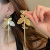 Wholesale Women's Silver Needle Hollow Flower Tassel Earrings With Real Gold Electroplating Zircon Star Pattern