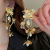 Wholesale Women's Silver Needle Hollow Flower Tassel Earrings With Real Gold Electroplating Zircon Star Pattern