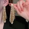 Wholesale Women's Silver Needle Hollow Flower Tassel Earrings With Real Gold Electroplating Zircon Star Pattern