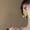 Wholesale Women's Silver Needle Hollow Flower Tassel Earrings With Real Gold Electroplating Zircon Star Pattern