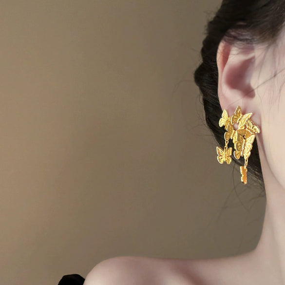 Wholesale Women's Silver Needle Hollow Flower Tassel Earrings With Real Gold Electroplating Zircon Star Pattern