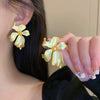 Wholesale Women's Silver Needle Hollow Flower Tassel Earrings With Real Gold Electroplating Zircon Star Pattern