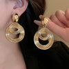 Wholesale Women's Silver Needle Hollow Flower Tassel Earrings With Real Gold Electroplating Zircon Star Pattern