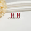 Wholesale Women's Silverplated Copper Oildrip Letter Earrings With Electroplating Process