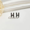 Wholesale Women's Silverplated Copper Oildrip Letter Earrings With Electroplating Process