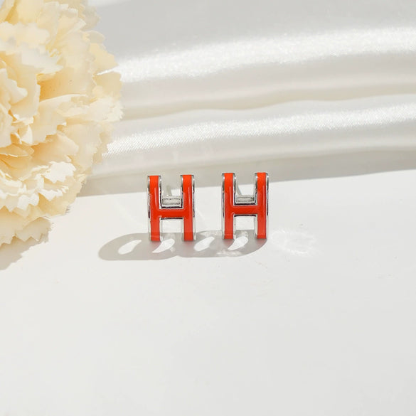 Wholesale Women's Silverplated Copper Oildrip Letter Earrings With Electroplating Process