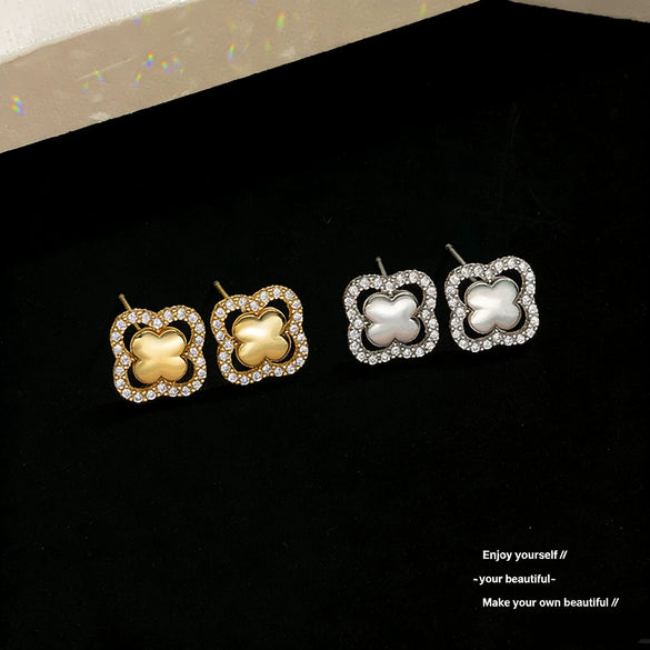 Wholesale Women's Sophisticated Diamond Leaf Pattern Copper Inlaid Zircon Four Leaf Clover Hollow Earrings