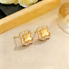 Wholesale Women's Sophisticated Diamond Leaf Pattern Copper Inlaid Zircon Four Leaf Clover Hollow Earrings