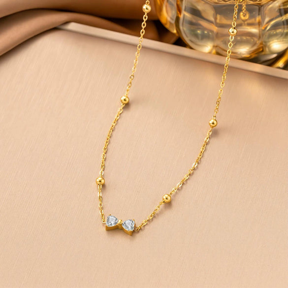 Wholesale Women's Sporty Geometric Zircon Bowknot Pendant Necklace With 18K Real Gold Plated Titanium Steel Ball Chain