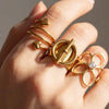 Wholesale Women's Stacking Stainless Steel Goldplated Ring With Geometric Heart Flower And Four Leaf Clover Shapes And Diamond Design
