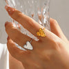 Wholesale Women's Stainless Steel And Titanium Steel Heartshaped Open Ring With Hammer Pattern And 18K Goldplated Electroplating