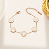 Wholesale Women's Stainless Steel And Titanium Steel Plant Fritillaria Fiveleaf Petal Jewelry Suit With Geometric Pattern And Gold Inlaid Treatment
