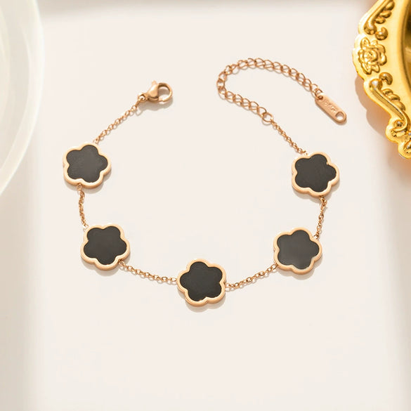 Wholesale Women's Stainless Steel And Titanium Steel Plant Fritillaria Fiveleaf Petal Jewelry Suit With Geometric Pattern And Gold Inlaid Treatment