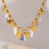 Wholesale Women's Stainless Steel Bow Love Pendant Necklace With Pearl Animal Pattern And Electroplating
