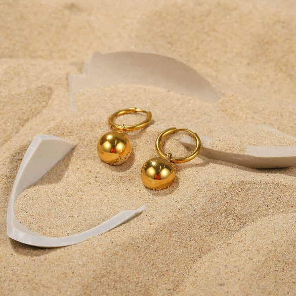Wholesale Women's Stainless Steel Earrings With Gold Ball Pendant And Geometric Design Electroplated