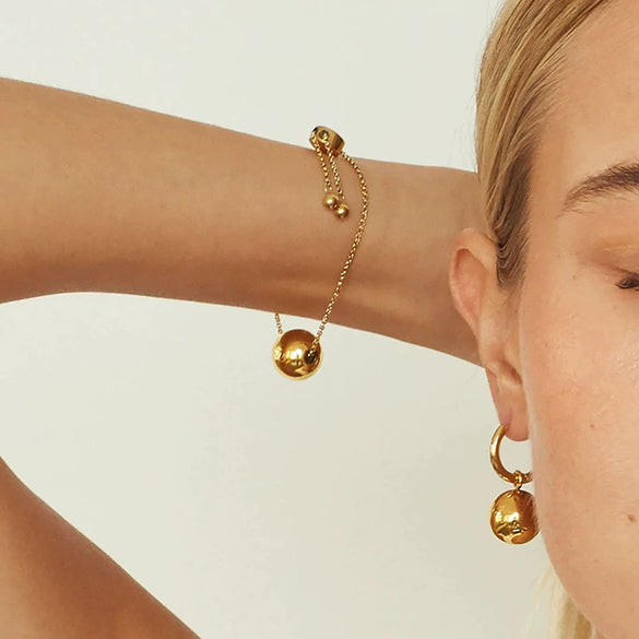 Wholesale Women's Stainless Steel Earrings With Gold Ball Pendant And Geometric Design Electroplated