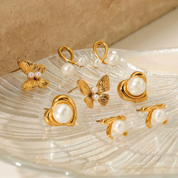 Wholesale Women's Stainless Steel Flower And Bow Earrings With Electroplating