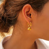 Wholesale Women's Stainless Steel Gold Plated Twist Hoop Earrings And Lip Ball Pendant With Letters Numbers Text Design