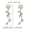 Wholesale Women's Stainless Steel Goldplated Flowerpatterned Long Tassel Earrings
