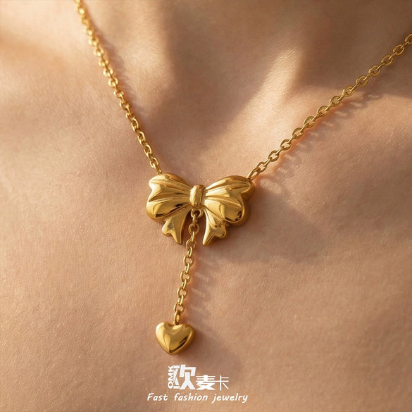 Wholesale Women's Stainless Steel Goldplated Heart Pendant Necklace And Earrings Jewelry Set With Bowknot And Tassel