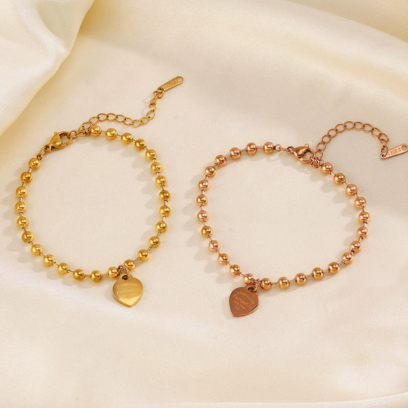Wholesale Women's Stainless Steel Heartshaped Love Bracelet With Round Beads And Electroplating