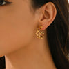 Wholesale Women's Stainless Steel Hollow Fourleaf Clover And Flower Earrings With 18K Gold Vacuum Plating