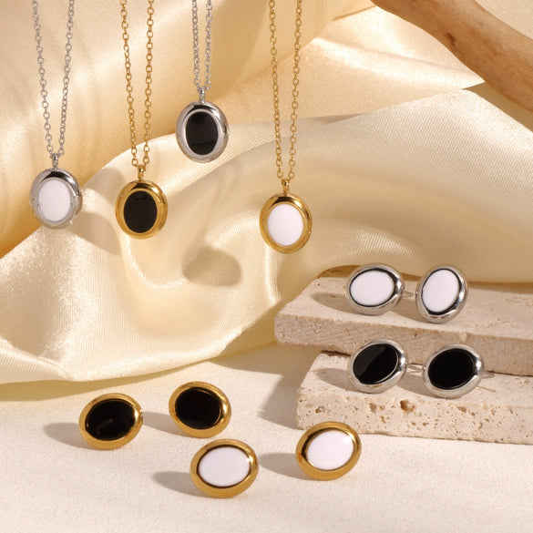 Wholesale Women's Stainless Steel Light Luxury Niche Design Cross Cat Eye Drop Oil Necklace Earrings Suit With Ellipse Pattern And Vacuum Real Gold Electroplating In Pvd Furnace