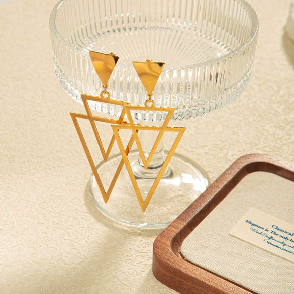 Wholesale Women's Stainless Steel Light Luxury Niche Design Overlapping Hollow Triangle Earrings With Leaves Pattern And Electroplating Treatment