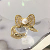 Wholesale Women's Sweet And Cute Bowknot Zircon Freshwater Pearl Ring Copper With 18K Real Gold Electroplated