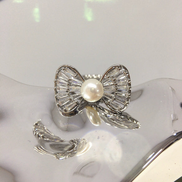 Wholesale Women's Sweet And Cute Bowknot Zircon Freshwater Pearl Ring Copper With 18K Real Gold Electroplated