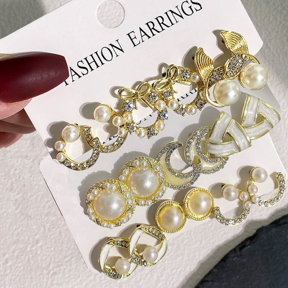 Wholesale Women's Sweet Geometric Artificial Pearl And Alloy Fishtail Moon Earrings Set With Pearl Inlaid