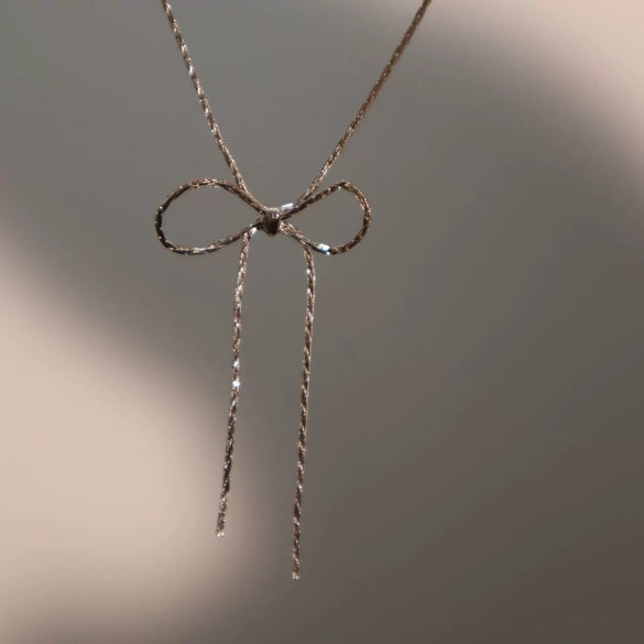 Wholesale Women's Sweet Retro Titanium Steel Bow Necklace With Gold Chain And Electroplating