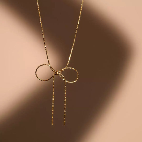 Wholesale Women's Sweet Retro Titanium Steel Bow Necklace With Gold Chain And Electroplating