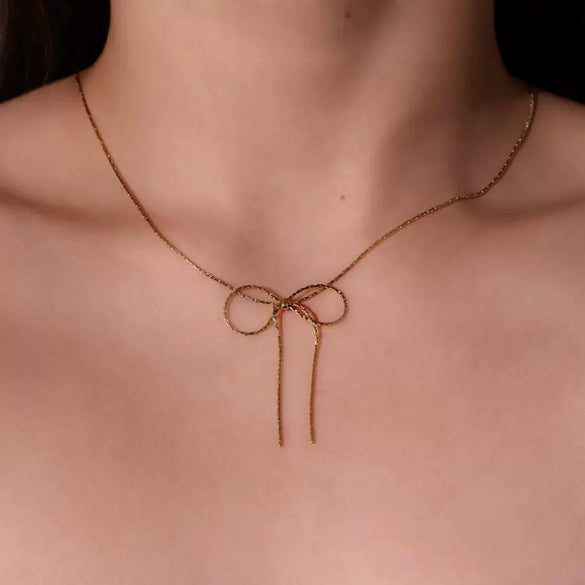 Wholesale Women's Sweet Retro Titanium Steel Bow Necklace With Gold Chain And Electroplating