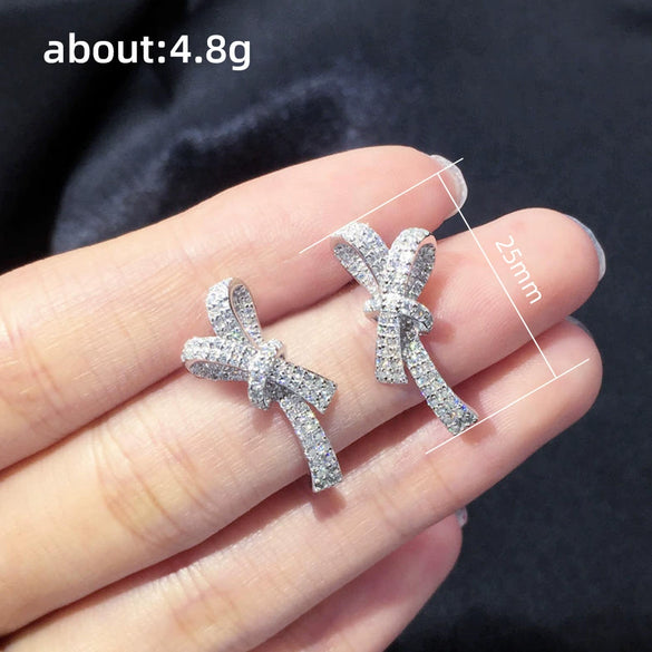 Wholesale Women's Sweet Style Copper Earrings With Inlaid Zircon And Bow Shape And Pattern
