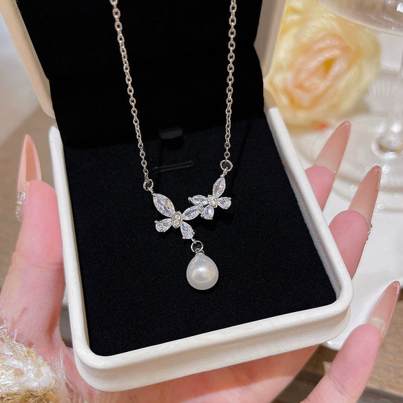 Wholesale Women's Titanium Steel And Copper Animal Zodiac Butterfly Zircon Pearl Pendant Necklace With Electroplating And Cross Chain