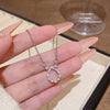 Wholesale Women's Titanium Steel And Copper Necklace With Diamond Design And Cross Chain Style Featuring A Zircon Bow Pendant