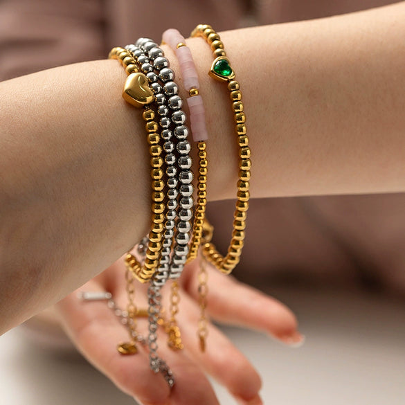 Wholesale Women's Titanium Steel And Stainless Steel Bracelet With 16K Gold Beads Green Love Zircon Geometric Pattern Electroplated